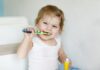 How to Make Brushing Fun (and Effective) for Toddlers child brushing teeth